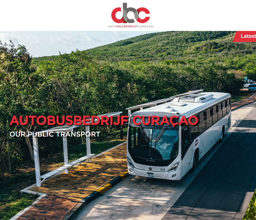 A full-size Autobusbedrijf Curaçao bus at a bus stop, shown on ABC’s website